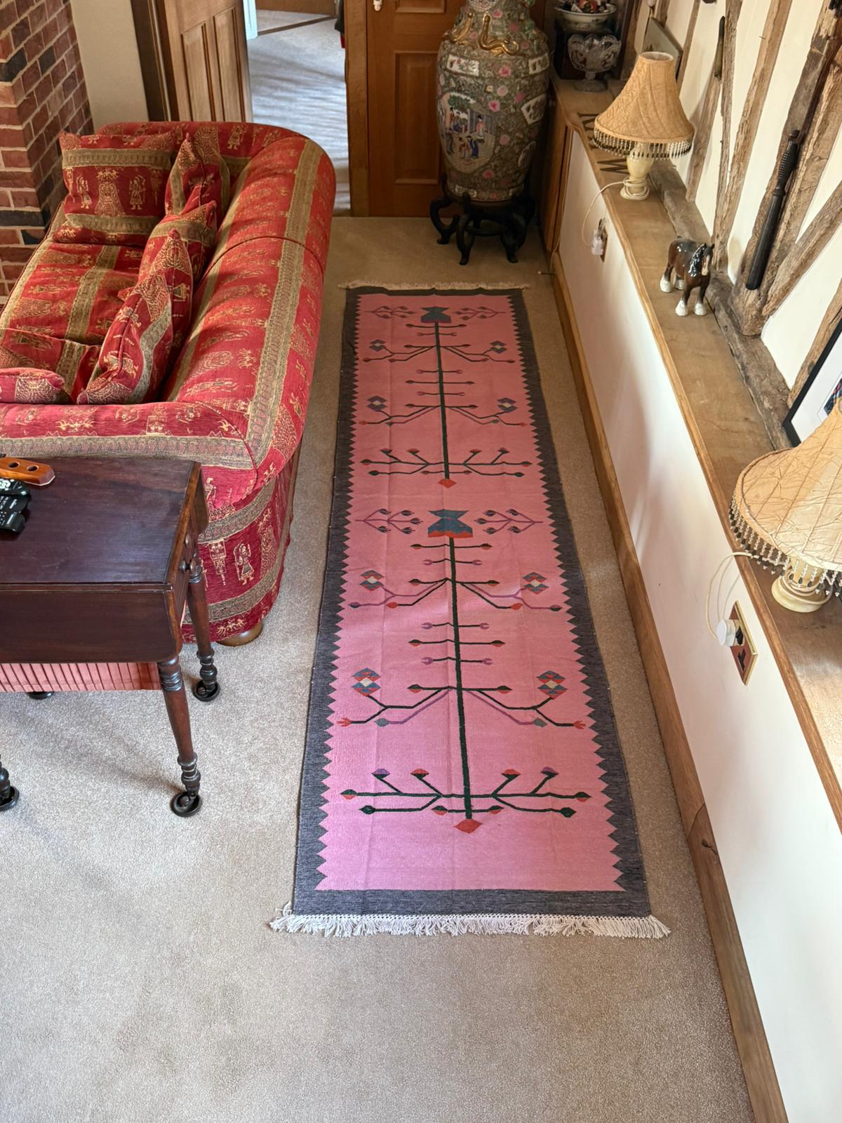 Beautiful handmade rug, showcasing traditional craftsmanship and durable fabric. It brings so much character to our home.